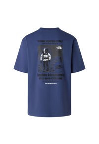 Námořnická modrá bavlněná trička s grafickým potiskem na zádech, zobrazujícím astronauta, text a logo od The North Face. Klasický kulatý výstřih.