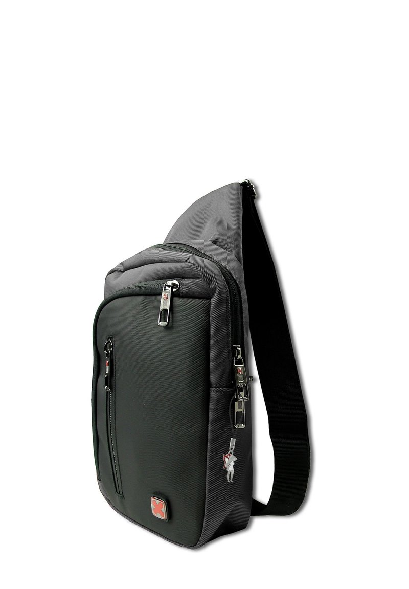 Compact zwarte schoudertas met meerdere ritscompartimenten, verstelbare schouderband en een rood kruislogo op het voorvak.