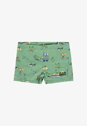 Pantaloncini da bagno verdi con una stampa giocosa di alieni impegnati in varie attività sulla spiaggia, vita elasticizzata e un dettaglio con logo sul lato.