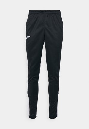 Zwarte sportbroek met een slim fit, gemaakt van een gladde stof. Bevat een wit logo en witte zijstrepen. Elastische tailleband.