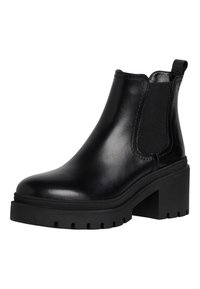 Botín negro de cuero hasta el tobillo con paneles elásticos, tacón estructurado y suela resistente. Cuenta con una textura suave y un diseño minimalista.