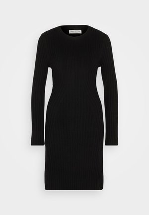 Musta neulemekko pitkillä hihoilla, ribbikuviointi ja kapeat linjat. Pyöreä pääntie ja polvipituinen muotoilu.