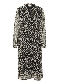 Robe à motifs noir et blanc avec manches longues, encolure ronde et taille cintrée, présentant un tissu fluide et transparent avec des motifs en forme de goutte.