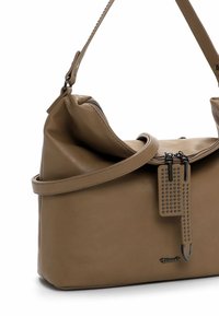 Brown leather shoulder bag with double zipper closure, decorative studded leather tags, and adjustable strap.