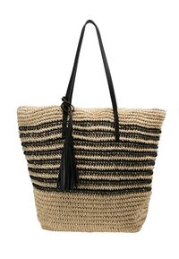 Tkaná slaměná taška s černými pruhy, vybavená dvěma koženými uchy a detailem s třásněmi. Texturovaný povrch dodává hloubku.