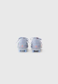 Light blue football cleats with a textured upper, soft laces, and orange accents on the heel and logo. Features plastic studs for traction.