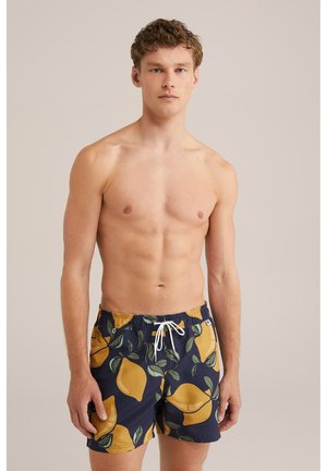 Navy swim shorts with yellow lemon pattern and green leaves. Features an elastic waistband with drawstring and side pockets.