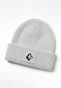 Gray knit beanie with a ribbed texture and a fold-over cuff. Features a rectangular patch displaying a black wolf silhouette.