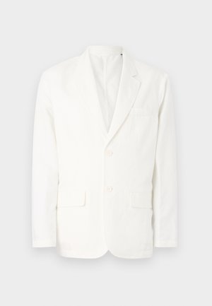 Blazer bianco in cotone con rever a punta, due tasche frontali, due bottoni e una tasca sul petto. Design semplice e pulito con una vestibilità su misura.
