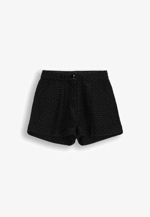 Czarne szorty z teksturowanym wzorem i subtelnymi białymi kropkami. Posiadają dwie przednie kieszenie oraz zapięcie na guzik w pasie.