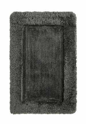Rectangular dark gray shaggy bath mat with a thick fluffy border and a dense flat inner section on a white background.