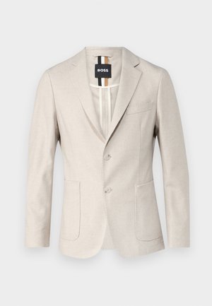 Blazer de un bej deschis, realizat dintr-un material țesut. Are un design cu un singur rând de nasturi, două buzunare în față și un guler cu decupaj. Stil minimalist.