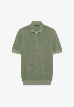 Polo majica s kratkimi rokavi iz teksturirane svetlo zelene tkanine z zadrgo na ovratniku in manšetami na rokavih, na kateri je vzorec diamantov.