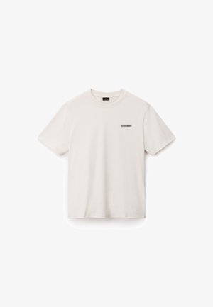 Krämbefärgad bomull t-shirt med korta ärmar och rundad halsringning. Har en liten svart logga tryckt på vänster bröstområde.