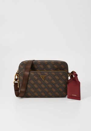 Brown patterned handbag with a gold logo, adjustable strap, one front zipper pocket, and a maroon tag accent. Textured synthetic material.