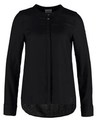 Black long-sleeve blouse with a round neckline, featuring a button placket and a textured lower hem. Smooth fabric with subtle sheen.