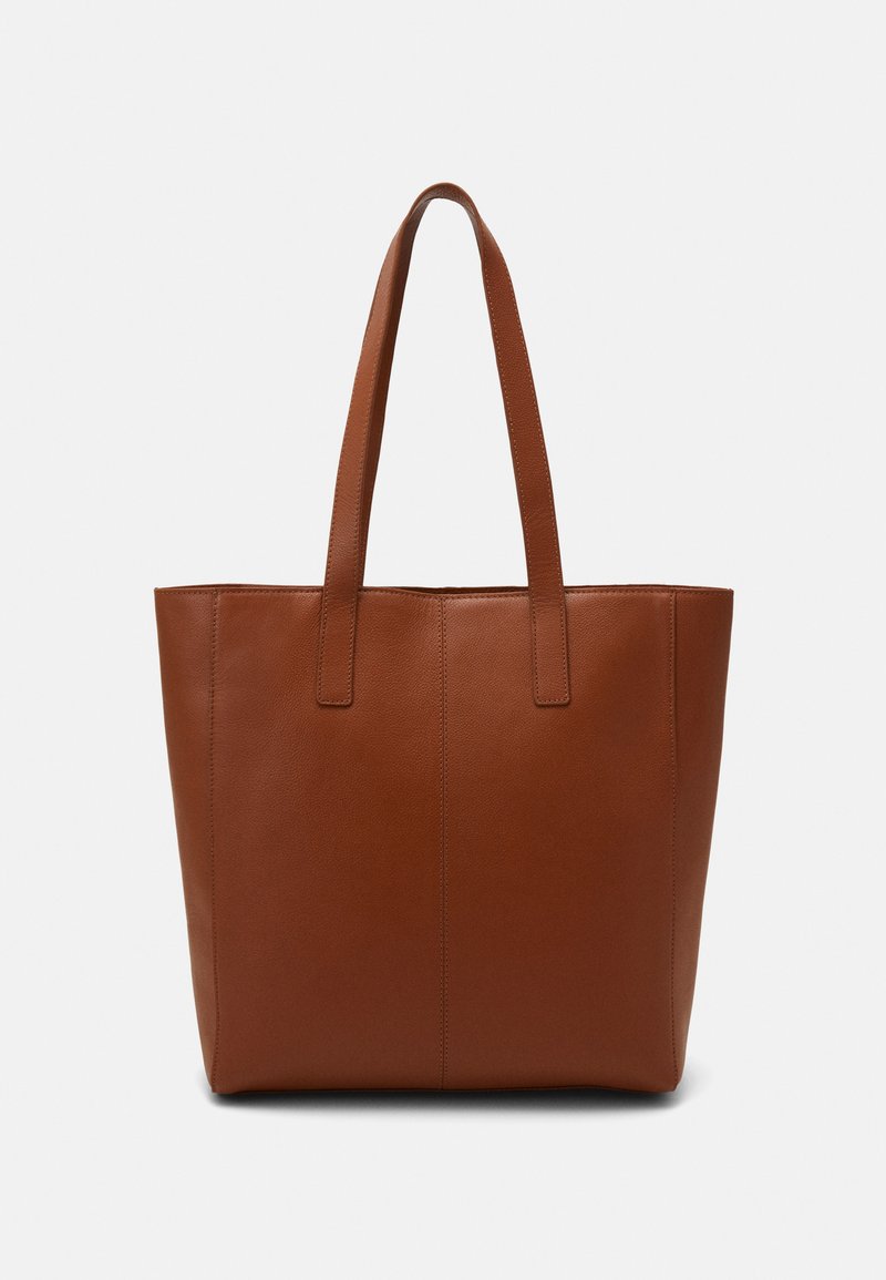 Brown leather tote bag with a smooth texture, vertical seam detailing, and two flat handles. Open top design, spacious interior.