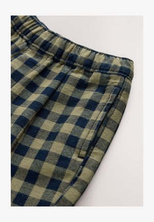 Ruudulliset housushortsit oliivinvihreinä ja laivastonsinisinä, joissa on joustava vyötärönauha ja sivusauman taskut. Pehmeä tekstuuri, rento muotoilu.