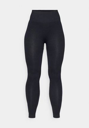 Schwarze gerippte Leggings mit hohem Bund, aus dehnbarem Material gefertigt. Verfügt über eine glatte Textur mit vertikalen Mustern.