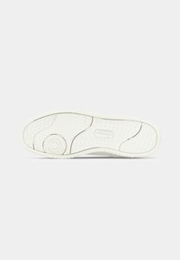 White sneaker sole with textured tread pattern and a circular design near the heel, branded with "JACK & JONES" in the center.