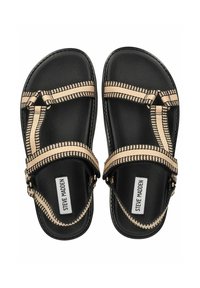 Sandali neri con cinturini intrecciati beige, caratterizzati da un motivo geometrico. Il design include una suola piatta e fibbie regolabili per una vestibilità ottimale.