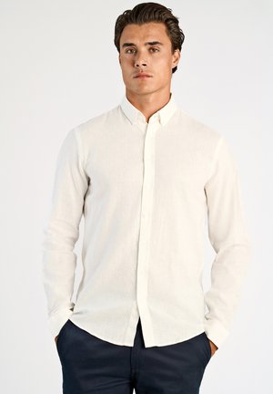 Wit overhemd met lange mouwen in lichtgewicht linnenstof met een subtiele textuur; heeft een klassieke kraag en een rechte zoom.