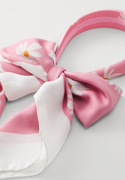 Pink silk scarf with a floral pattern featuring white daisies and a central knot. Edges are white with a smooth finish.