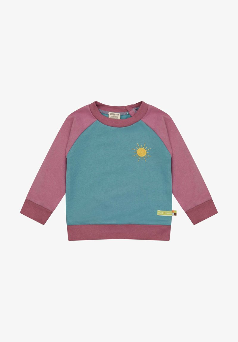 Baumwoll-Sweatshirt mit teal-farbenem Körper und pinken Raglanärmeln. Auf der Vorderseite befindet sich ein gelbes Sonnenmotiv und ein Logo-Patch am Saum.