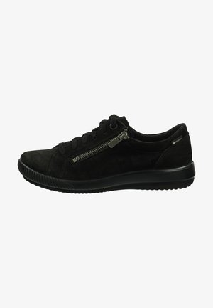 Black suede sneaker with lace-up closure, side zipper detail, and rubber sole, featuring a smooth texture and rounded toe design.