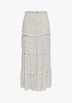 Hvid lagdelt maxinederdel med små sorte blomsterprint og indsamlede syninger, der skaber flæselag.