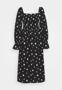 Robe midi noire avec manches longues bouffantes, corsage smocké, encolure carrée et motif marguerites blanches et croix.