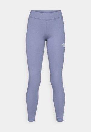 Leggings sportivi blu realizzati in un morbido e elastico tessuto. Presentano un'alta vita e un piccolo logo bianco sulla coscia sinistra.