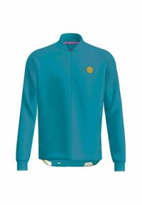 Chaqueta de color verde azulado con cremallera completa, mangas largas, cuello redondo, paneles de hombro texturizados y pequeño logo circular amarillo en el pecho.