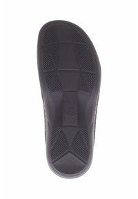 Zwarte rubberen schoenzool met een gestructureerd grippatroon met hoekige ontwerpen en een centraal logo. Maat aangeduid als 36.