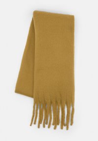 Écharpe jaune moutarde en tissu doux et texturé, avec des extrémités à franges et une forme rectangulaire. Convient pour une utilisation par temps froid.
