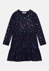 Dlouhý rukáv šaty v námořnické bavlně s víceúrovňovým designem. Pokryté barevnými, lesklými vzory hvězd, s kulatým výstřihem a elastickými manžetami.