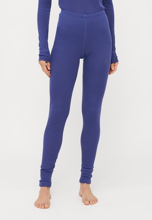 Lilla tights laget av myk og elastisk stoff. Har høyt liv og tettsittende design med en liten logo på hoften. Glatt tekstur og full lengde.