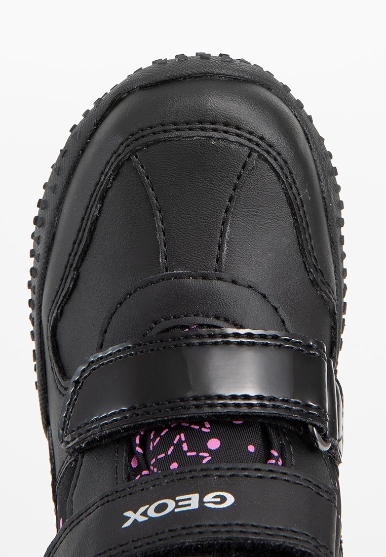 Schwarzer synthetischer Schuh mit strukturierten Oberflächen, Klettverschluss und pinkfarbigem Punktmuster-Fütterung. Hat eine dicke Gummisohle mit rutschfester Oberfläche.