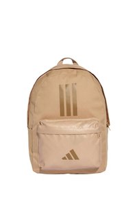 Zaino beige realizzato in tessuto resistente, con un ampio compartimento principale, una tasca frontale con cerniera e il logo Adidas con le tre strisce dorate.