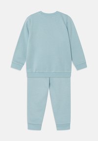 Puma UNISEX SET turkusowy