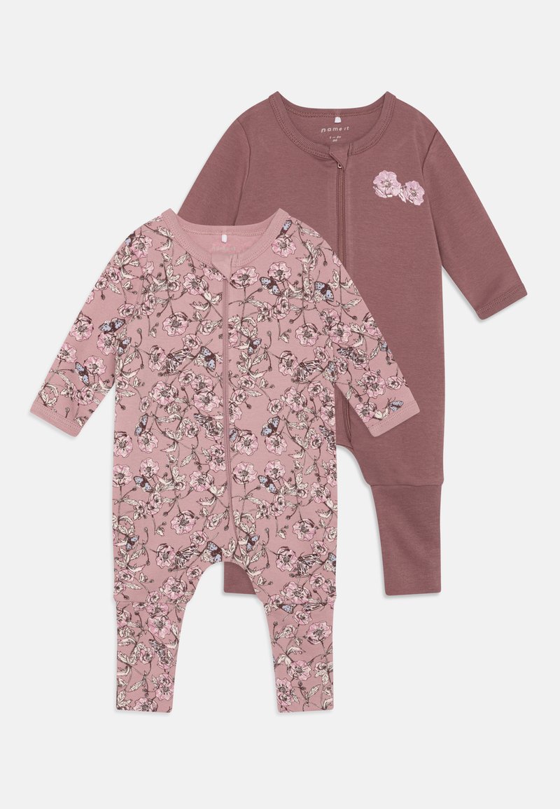 Two baby bodysuits: one solid dusty rose with a floral design, and one with a pink floral print; both feature zippers and long sleeves.