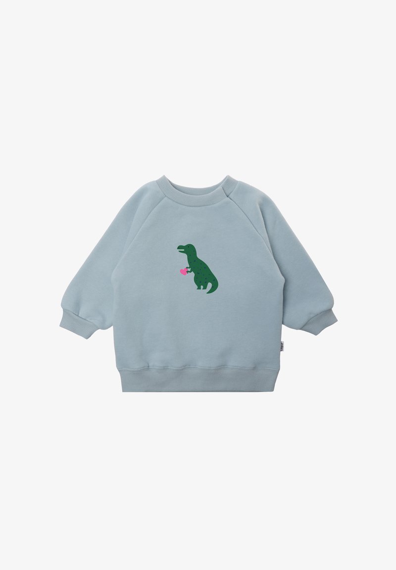 Hellblaues Sweatshirt mit Raglanärmeln, mit einem grünen Dinosaurier-Graphic, der ein pinkes Herz auf der Vorderseite hält. Fleece-Material, weiche Textur.
