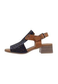 Sandales à talons ouverts avec une tige navy ornée de motifs découpés, des accents en cuir marron, une bride de cheville ajustable et un talon en bloc empilé.