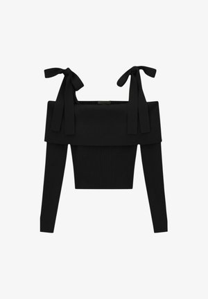 Top nero a coste, scollato sulle spalle, maniche lunghe, con ampia scollatura e spalline annodate.