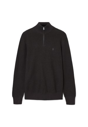 Pull en tricot noir avec zip quart et petit logo brodé sur la poitrine gauche, manches longues, et bords côtelés aux poignets et à l'ourlet.