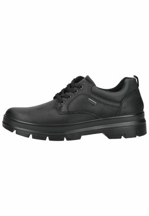 Schwarzer Leder-Schnürschuh mit dicker profilierter Gummisohle und gepolstertem Schaft, seitlichem Metall-Brandetikett und Zuglasche an der Ferse.