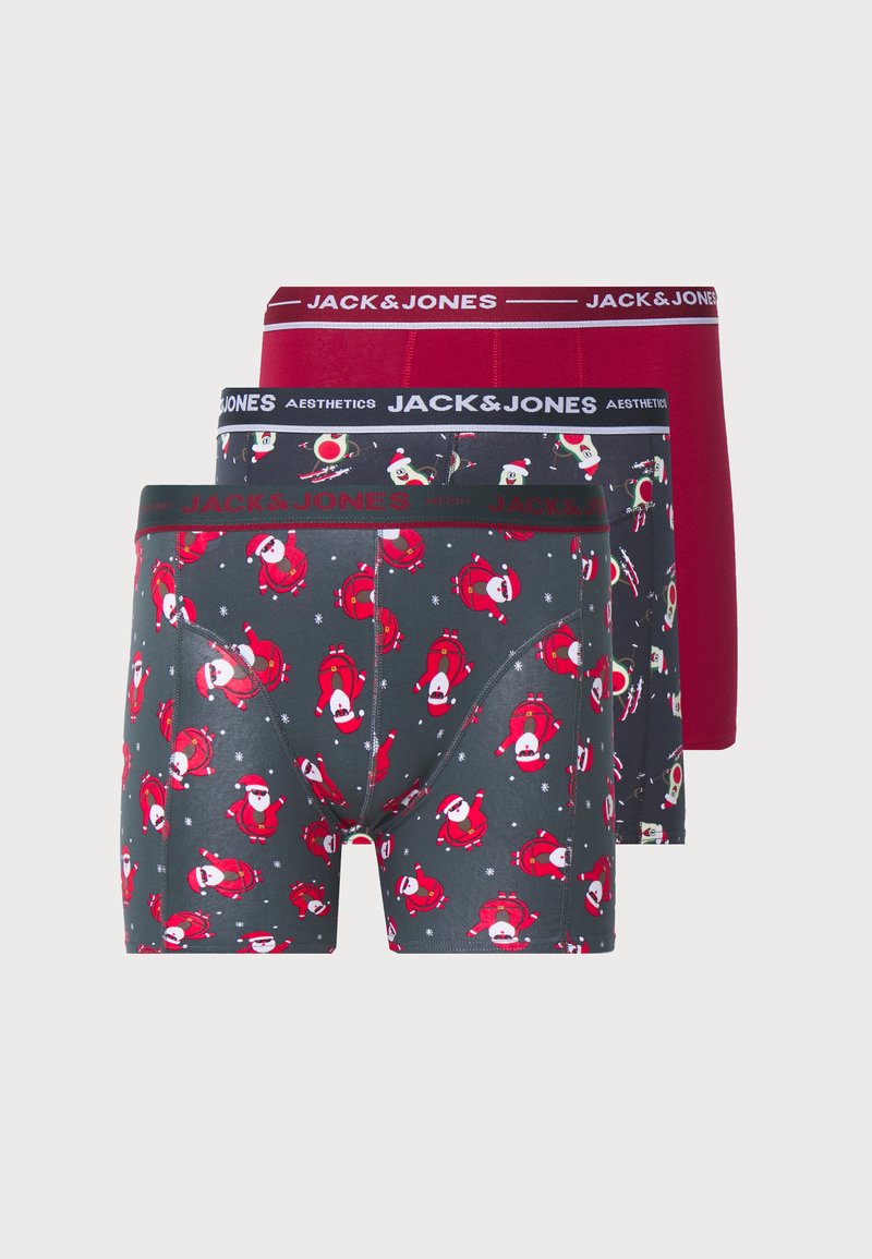 Drei Paare Männerboxershorts. Ein Paar hat einen dunkelgrauen Stoff mit roten Weihnachtsmann-Mustern. Die anderen beiden sind einfarbig rot und grau mit Logo-Gummibündchen.