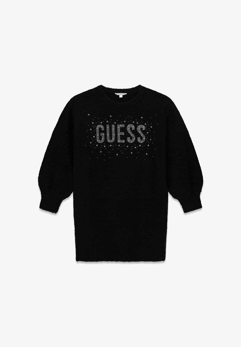 Pull noir en tissu doux avec col rond, manches longues bouffantes, et un logo "GUESS" scintillant orné de strass.