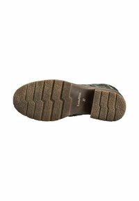 Suola di scarpa in gomma con un design texture, caratterizzata da profonde scanalature e un tallone pronunciato. Contrassegnata "LunaVit® 37" vicino all'area del tallone.