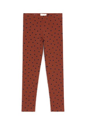 Leggings couleur rouille avec petits pois noirs, texture côtelée et taille élastique.